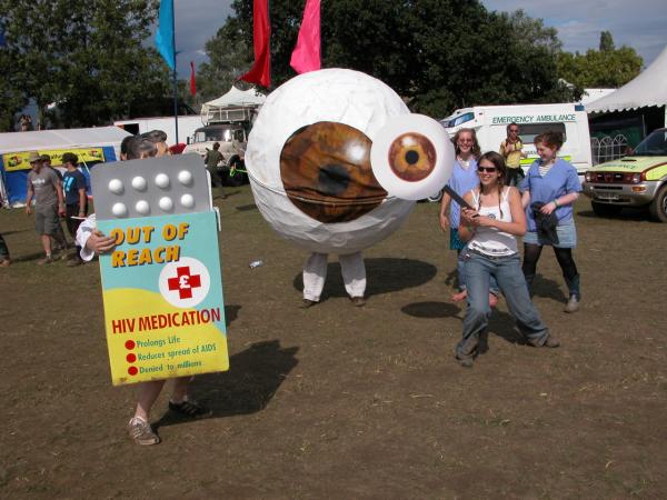 Treat AIDS campaigners wearing eyeball and pill packet costumes