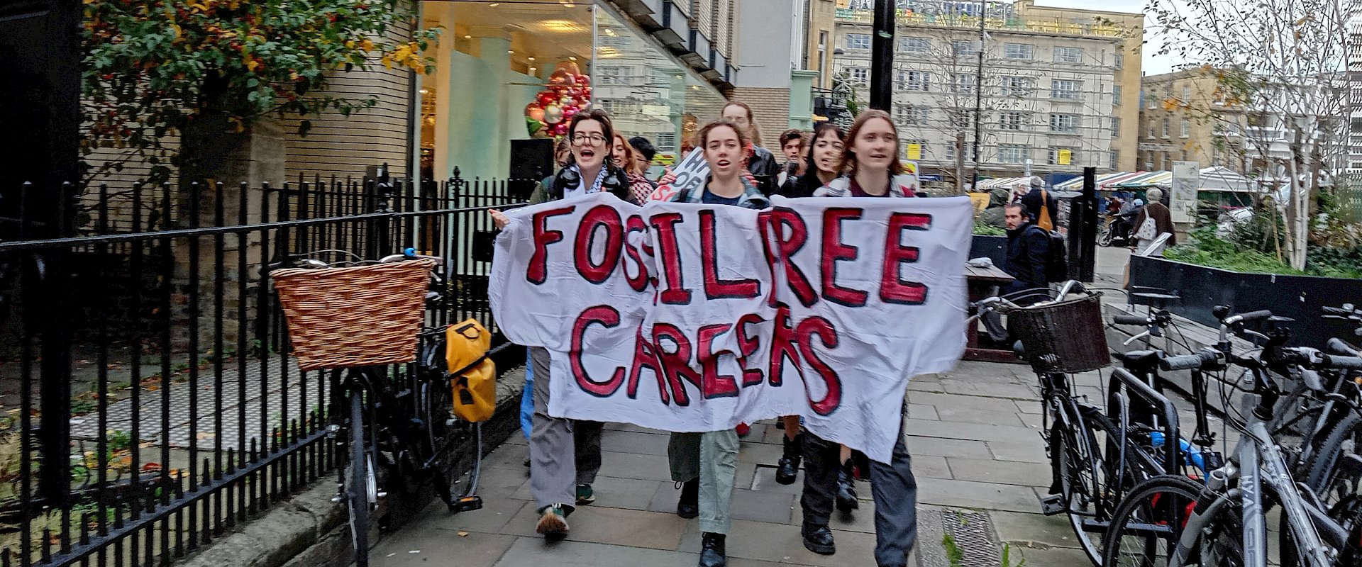 Group of students holding up banner that reads Fossil Free Careers