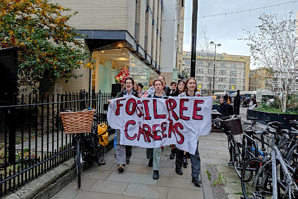 Group of students holding up banner that reads Fossil Free Careers